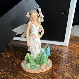 Elegant Fairy Sculpture with White Dress and Green Accents